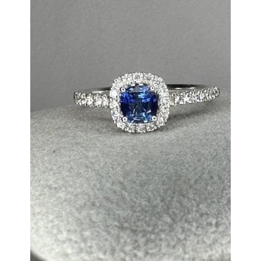 18ct White Gold Cushion Shaped Sapphire Halo and Diamond shoulders