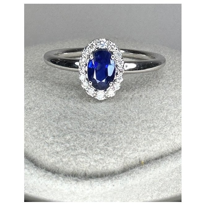 Coloured Stones 18ct White Gold Oval Sapphire and Diamond halo ring 
