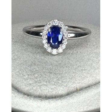 18ct White Gold Oval Sapphire and Diamond halo ring 