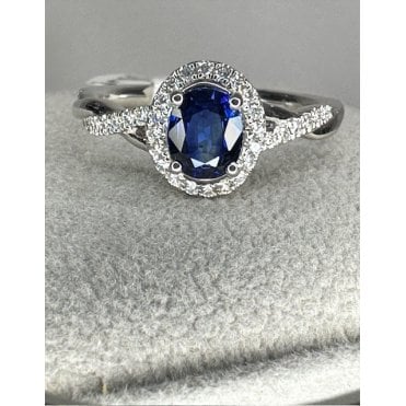 Platinum Oval Shape Sapphire and Diamond Halo Ring Twist Diamond Shoulders